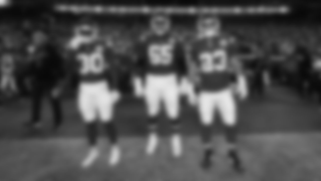 Team captains cornerback Chris Roland-Wallace (30), offensive lineman Trey Smith (65), and Kansas City Chiefs middle linebacker Drue Tranquill (23) prior to a week 6 NFL Football game against the Detroit Lions on Sunday, October 12, 2025 in Kansas City, MO.