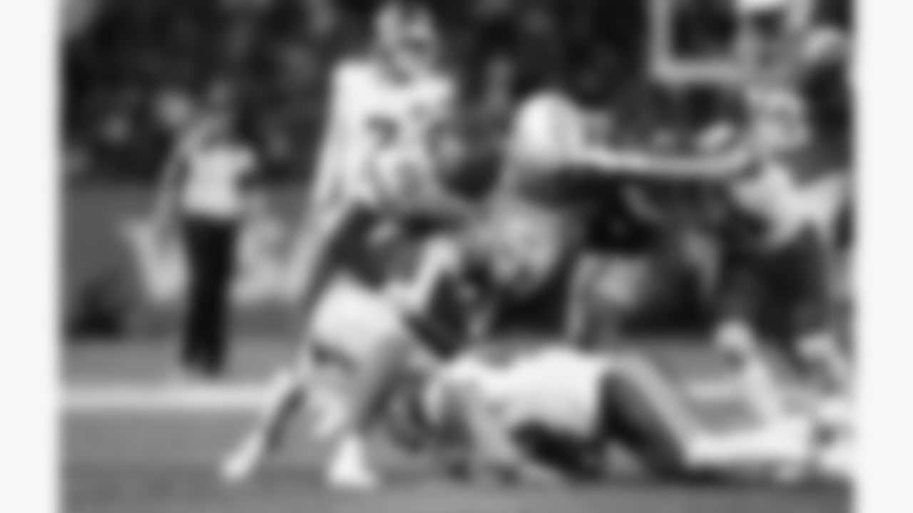 Kansas City Chiefs linebacker Jack Cochrane (43) and defensive back Nohl Williams (20) tackle a Los Angeles receiver during a week 1 NFL football game against the Los Angeles Chargers at Arena Corinthians in São Paulo, Brazil on September 5, 2025.