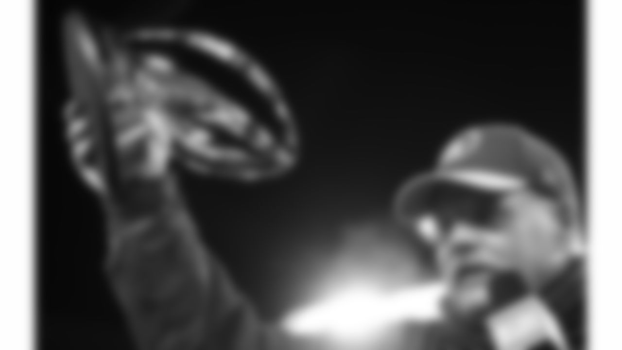 Kansas City Chiefs Head Coach Andy Reid raises the Lamar Hunt Trophy in the air following the AFC Championship Game against the Baltimore Ravens on Sunday, January 28, 2024 in Baltimore, MD.