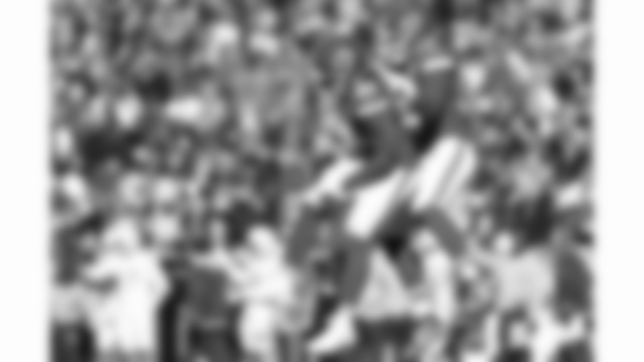 Kansas City Chiefs defensive end Mike Danna (51) and defensive end George Karlaftis (56) celebrate during a week 15 NFL football game against the Los Angeles Chargers, Sunday, December 14, 2025 in Kansas City, MO.