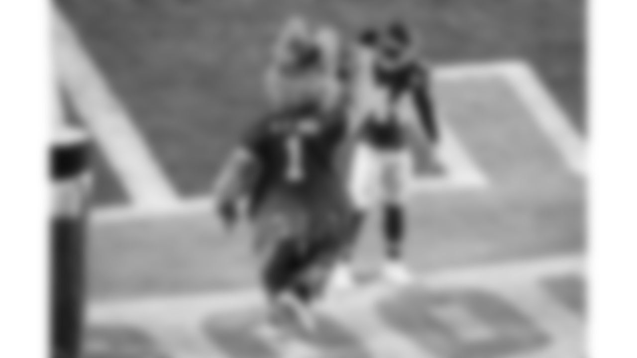 Kansas City Chiefs linebacker Cam Jones (44) high-fives KC Wolf during the AFC Championship game against the Buffalo Bills on Sunday, January 26, 2025.