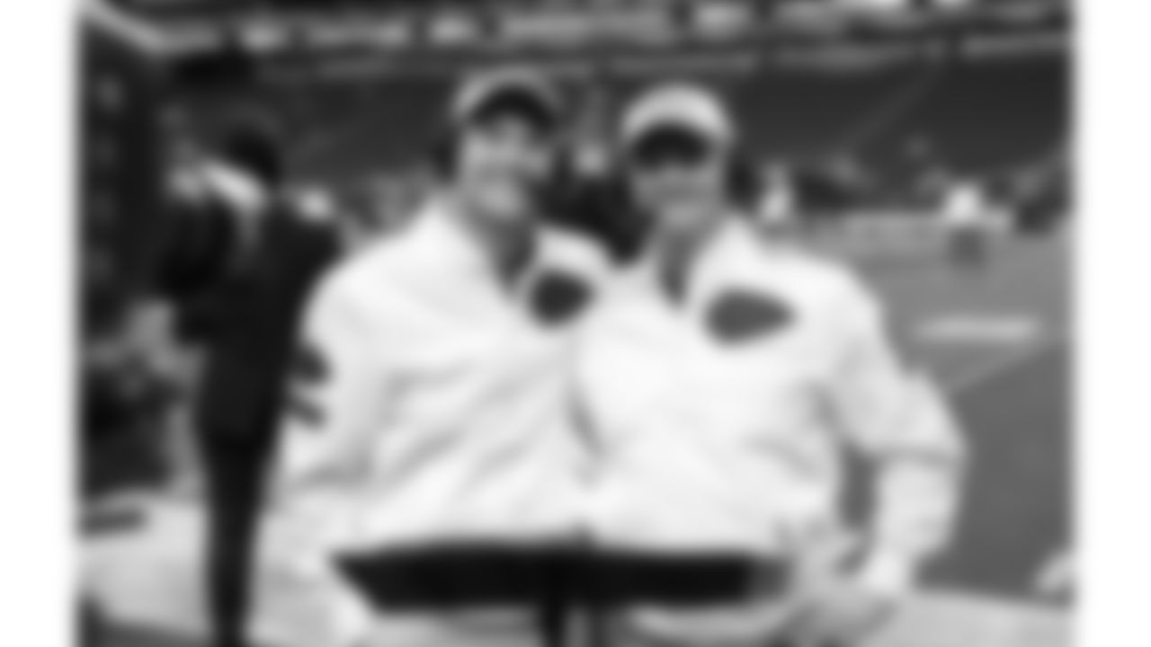 Kansas City Chiefs senior team reporter Matt McMullen and Voice of the Chiefs Mitch Holthus on the field prior to a week 18 game against the Las Vegas Raiders on Sunday, January 3, 2026.