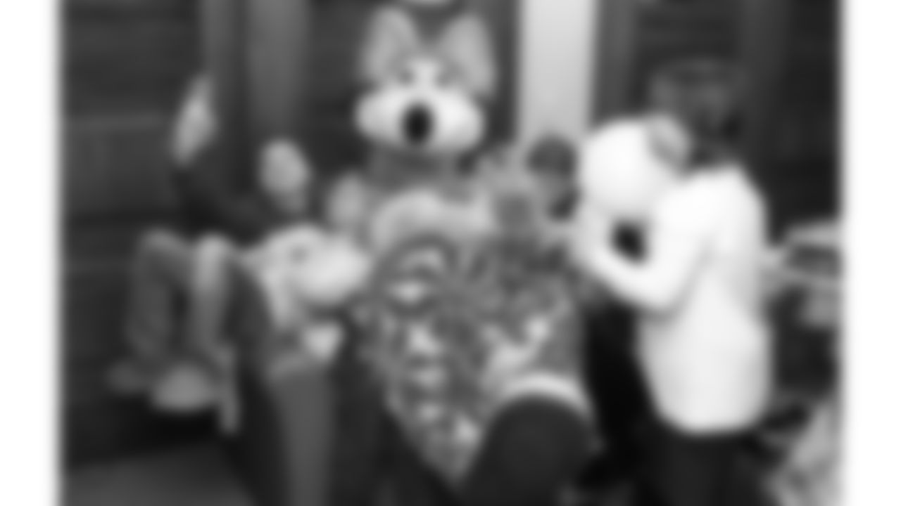 KC Wolf plays games with families before the reveal of cornerback Trent McDuffies (22) My Cause My Cleats at the Solace House in Shawnee Mission, Kansas on Tuesday, November 11, 2025.