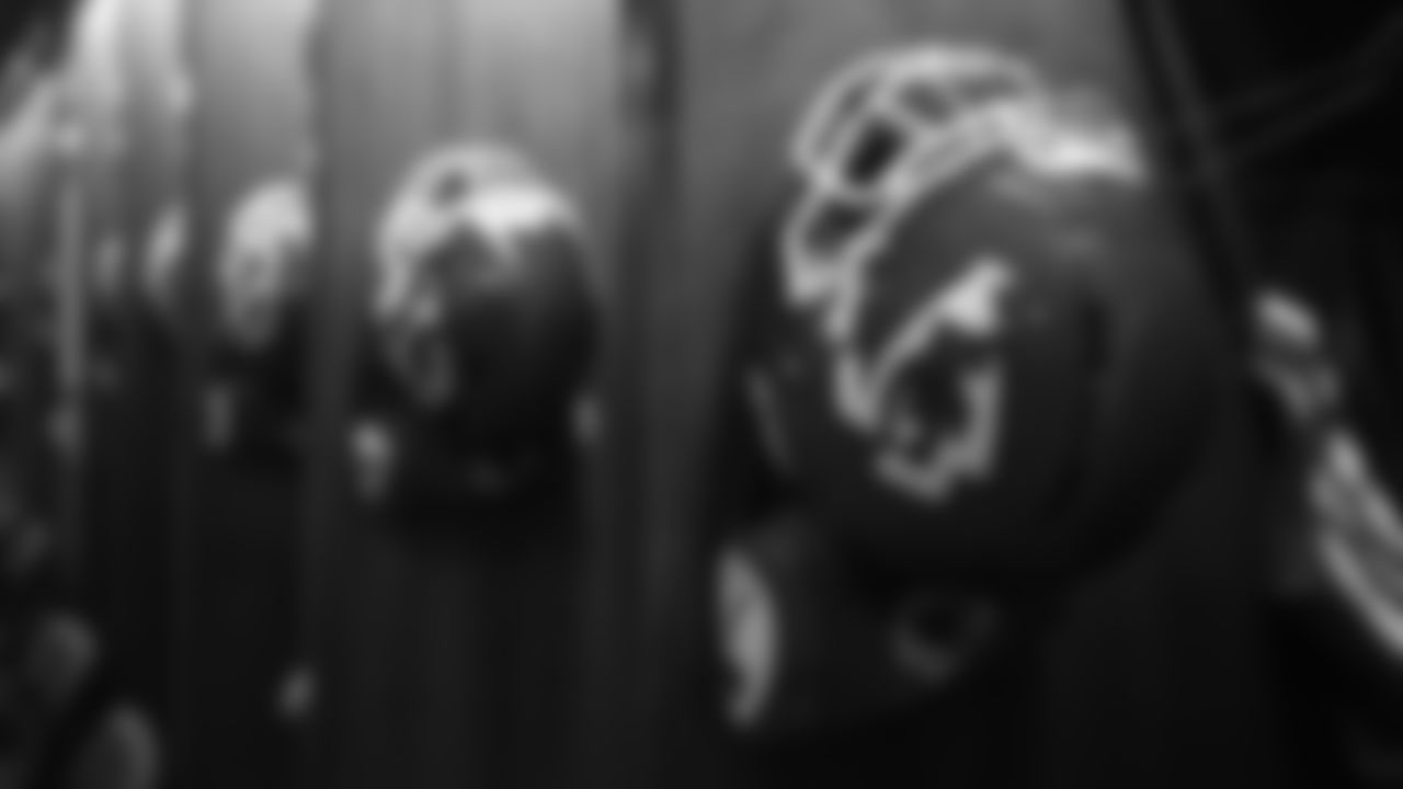 Helmets hanging in the visiting locker room of Nissan Stadium prior to a week 16 NFL football game against the Tennessee Titans on Sunday, December 21, 2025 in Nashville, Tennessee.
