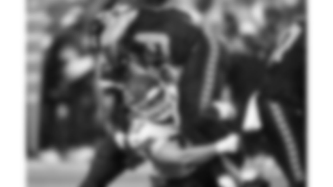 Kansas City Chiefs defensive end Ashton Gillotte (97) tackles Seattle Seahawks wide receiver Jake Bobo (19) during a preseason week 2 NFL football game, Friday, August 15, 2025 in Seattle, WA.