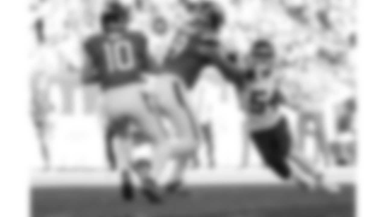 Kansas City Chiefs linebacker Leo Chenal (54) rushes the quarterback during a week 11 NFL Football game against the Denver Broncos on Sunday, November 16, 2025 in Denver, Colorado.