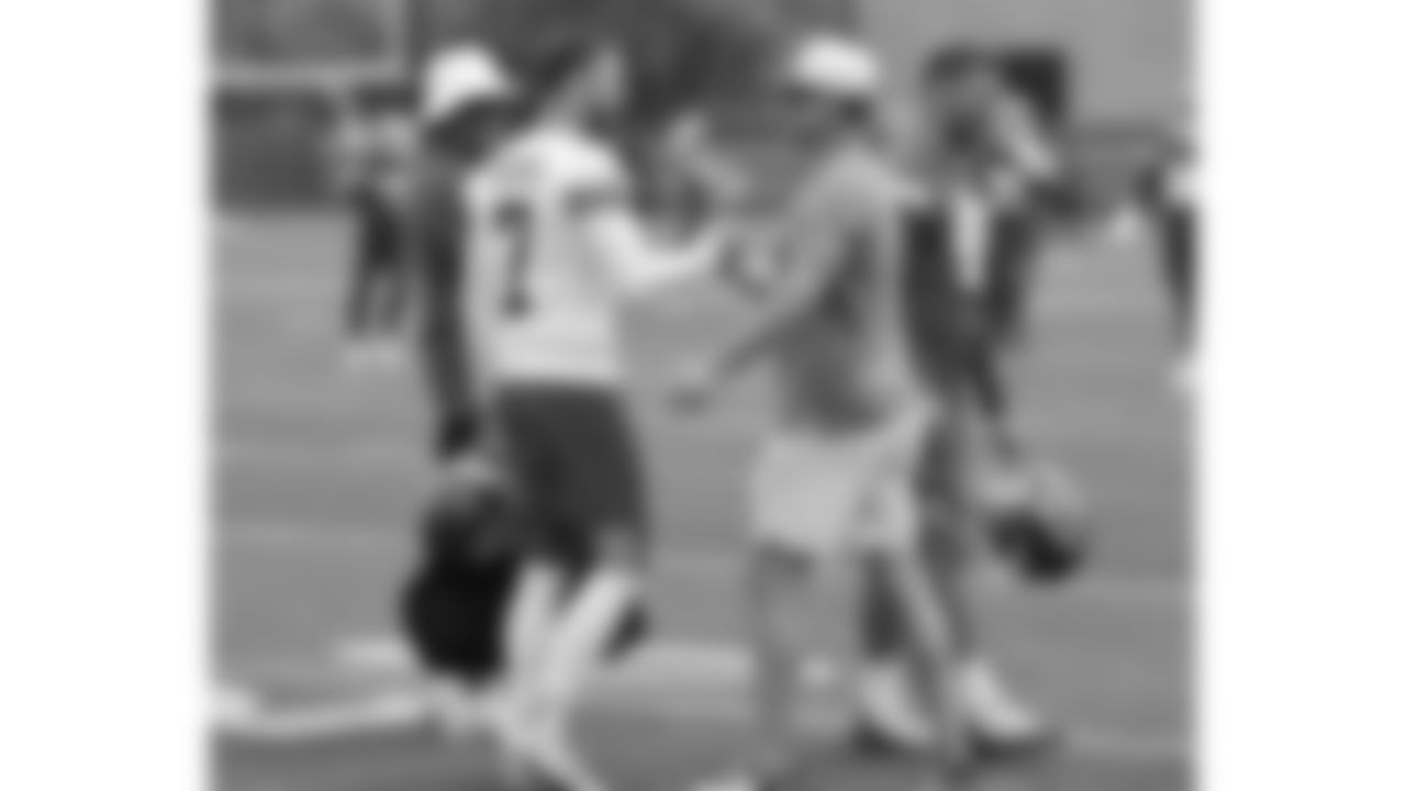 Former Kansas City Chiefs punter Dustin Colquitt shakes hands with kicker Harrison Butker (7) while attending a practice during phase 3 of OTAs on Wednesday, June 4, 2025 in Kansas City, MO.