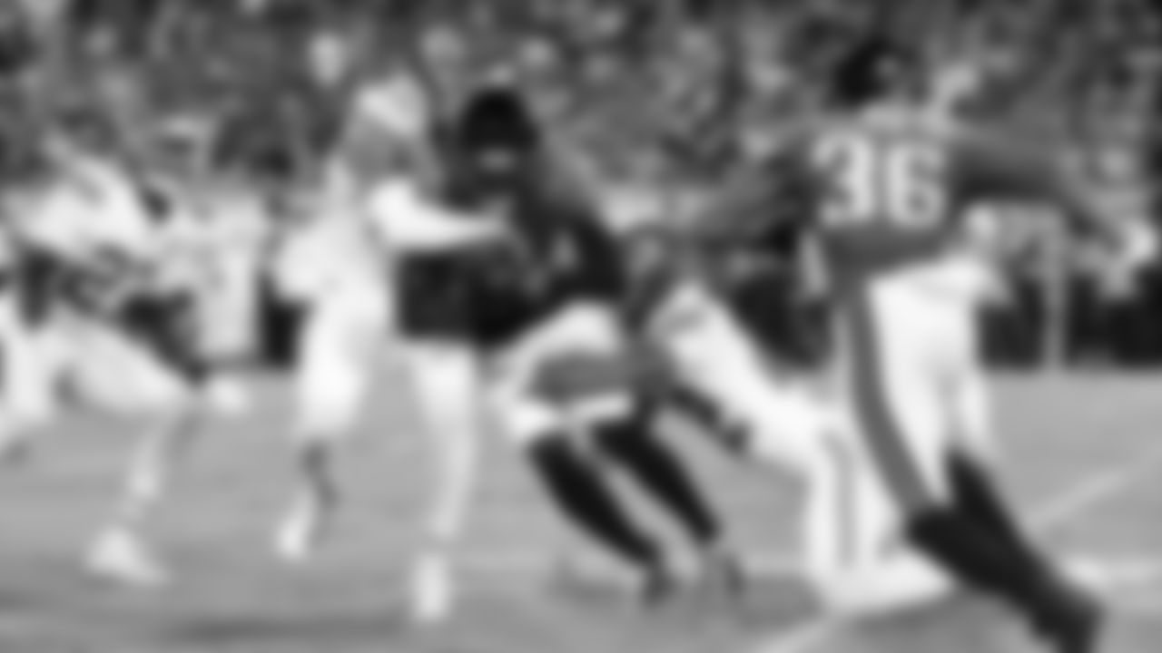 Kansas City Chiefs defensive back Jaden Hicks (21) and Kansas City Chiefs cornerback Trent McDuffie (22) make a tackle during a week 5 NFL football game against the Jacksonville Jaguars, Monday, October 6, 2025, in Jacksonville, FL.