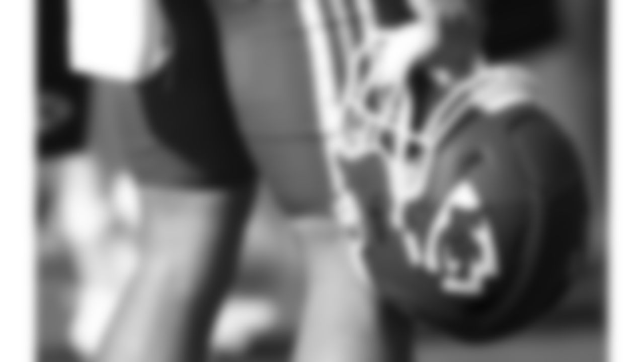 A Kansas City Chiefs player holds their helmet during day 5 of training camp practice on Sunday, July 27, 2025.