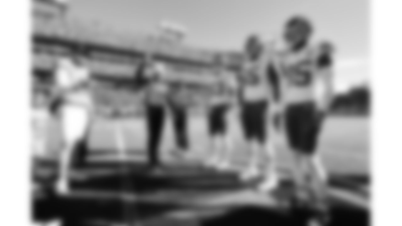 Kansas City Chiefs cornerback Jaylen Watson (35), offensive lineman Trey Smith (65) and tight end Noah Gray (83) during the coin toss prior to a week 16 NFL Football game against the Tennessee Titans on Sunday, December 21, 2025 in Nashville, Tennessee.