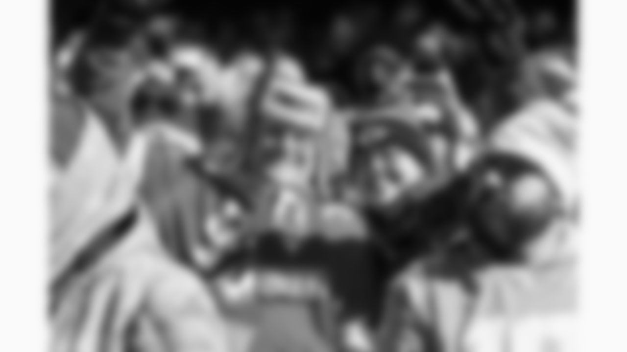 Kansas City Chiefs fans smile during a week 15 NFL football game against the Los Angeles Chargers, Sunday, December 14, 2025 in Kansas City, MO.