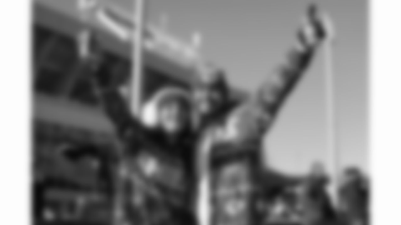 Kansas City Chiefs fans pose prior to a week 15 NFL football game against the Los Angeles Chargers, Sunday, December 14, 2025 in Kansas City, MO.