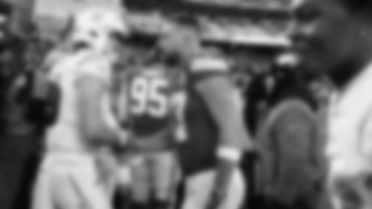 Kansas City Chiefs tight end Travis Kelce (87) shakes hands with San Diego Chargers quarterback Justin Herbert (10) after an NFL week 15 matchup against the Los Angeles Chargers, Sunday December 14, 2025.