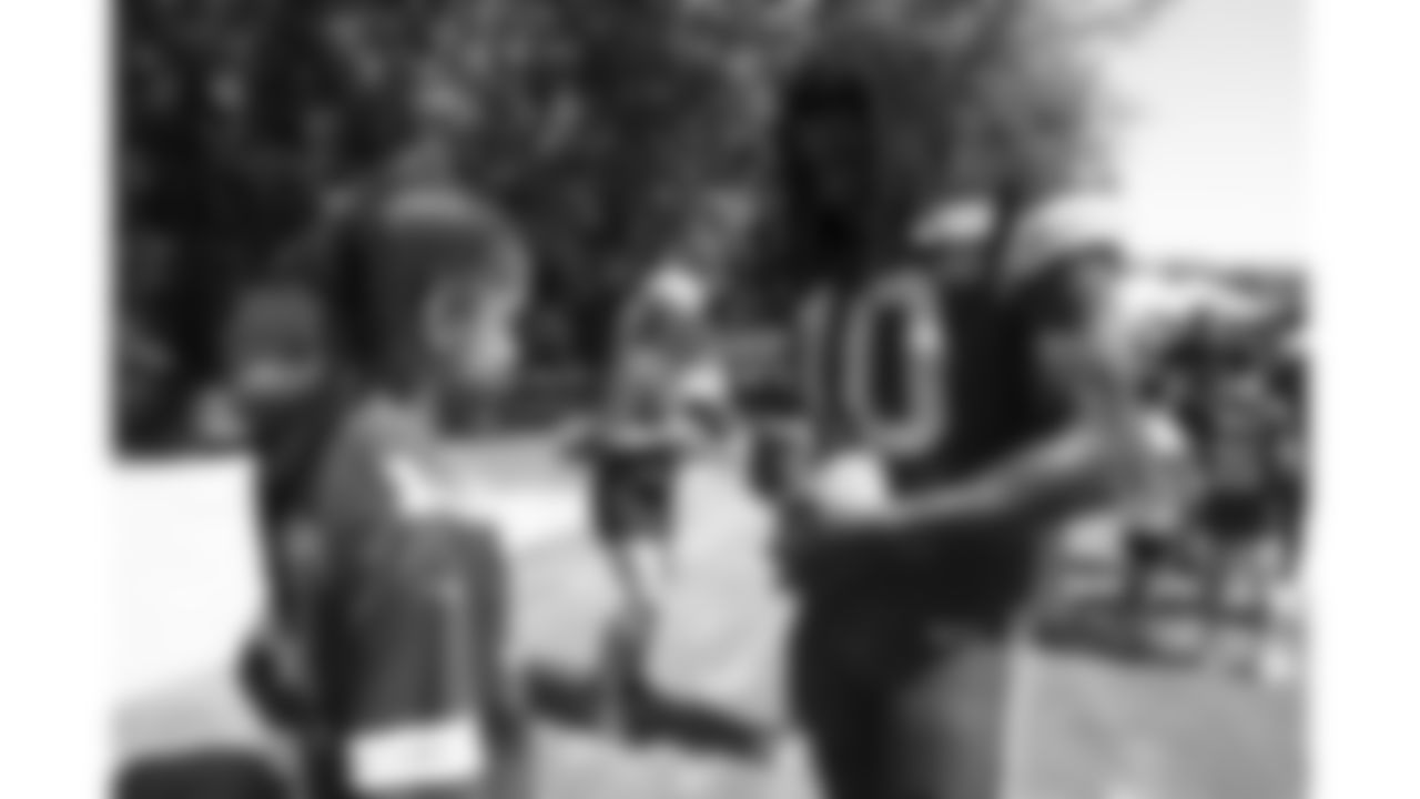Kansas City Chiefs running back Isiah Pacheco (10) with Make A Wish and dream factory kids during day 7 of training camp on Tuesday, July 29, 2025.