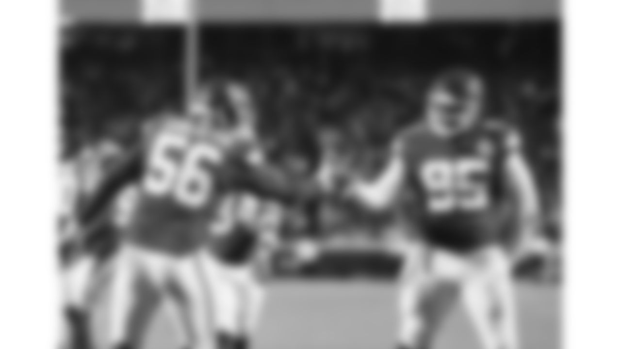 Kansas City Chiefs defensive end George Karlaftis (56) and defensive tackle Chris Jones (95) do a celebratory hand shake during a week 14 NFL football game against the Houston Texans, Sunday, December 7, 2025 in Kansas City, MO.