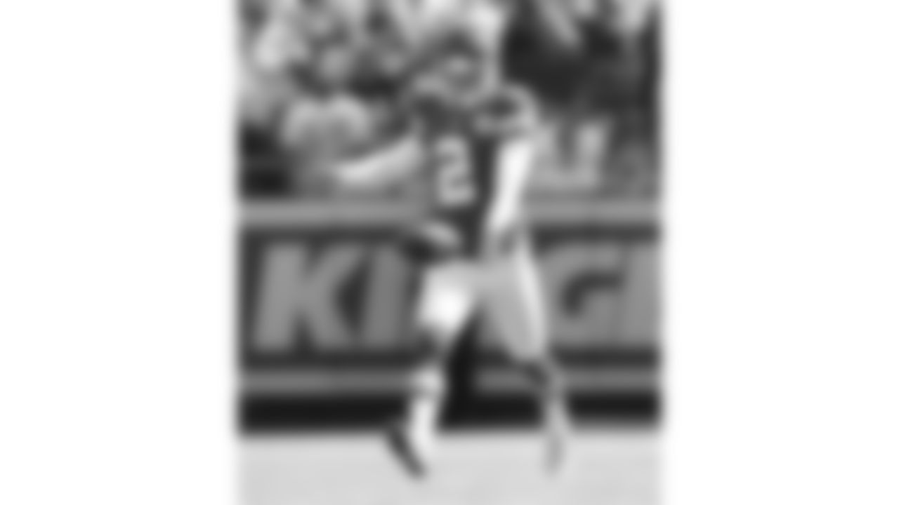 Kansas City Chiefs punter Dustin Colquitt (2) punts the ball across the field.