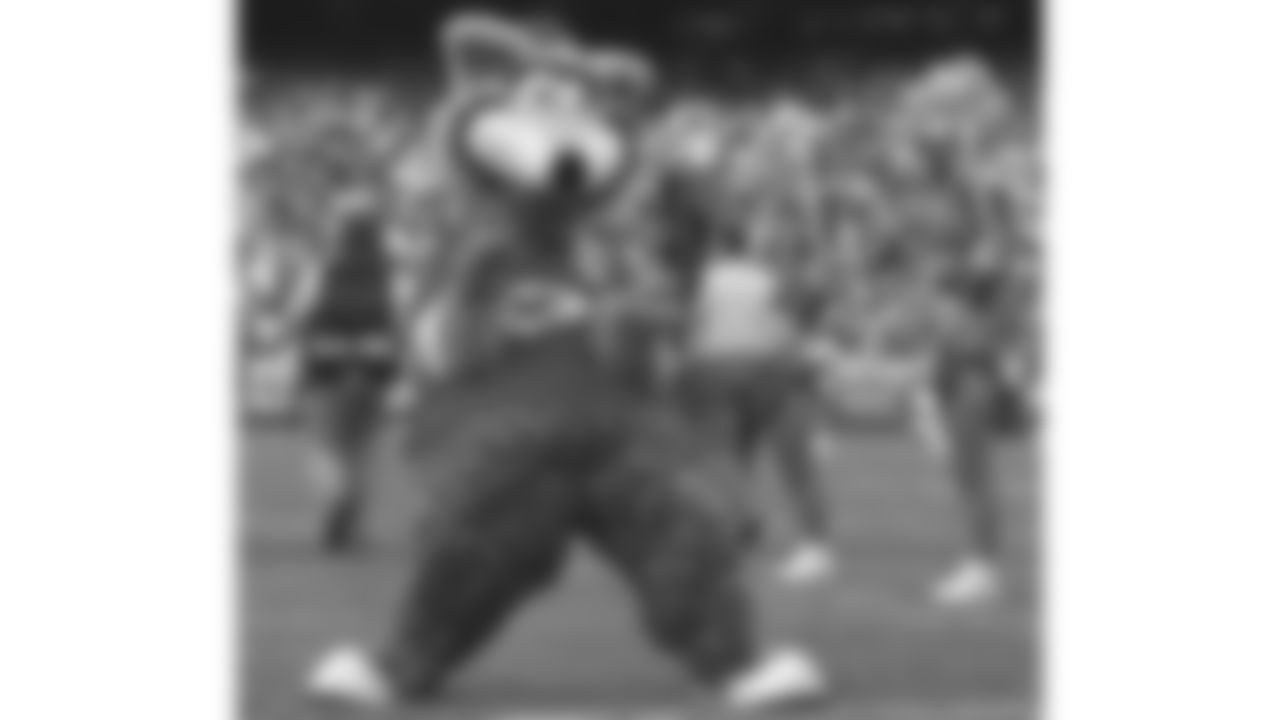 KC Wolf performs at a 1993 home game.