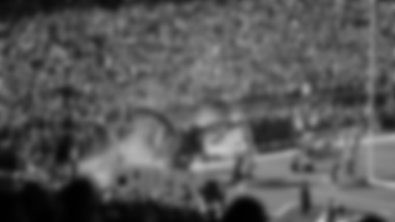 Chiefs Flag Runners enter the field during a week 7 NFL Football game against the Las Vegas Raiders on Sunday, October 19, 2025.