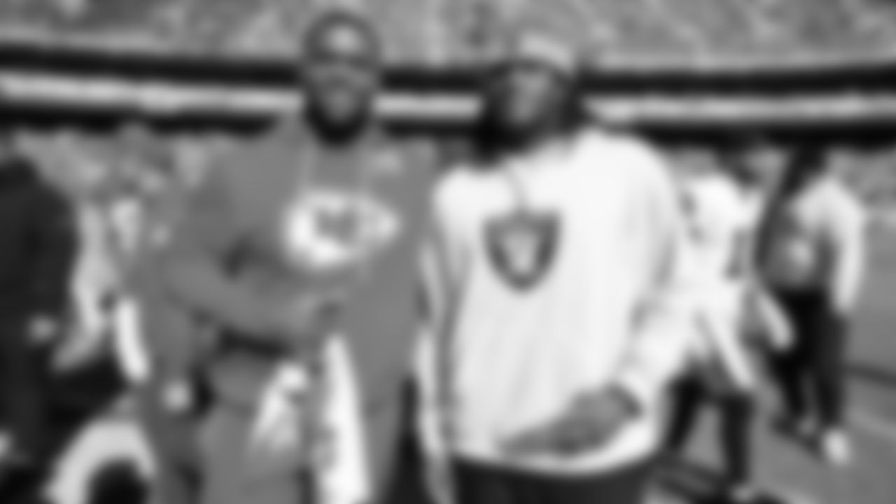 Kansas City Chiefs defensive tackle Zach Picken (79) poses for a photo with a Las Vegas Raiders player after a week 7 NFL Football game against the Las Vegas Raiders on Sunday, October 19, 2025 in Kansas City, MO.