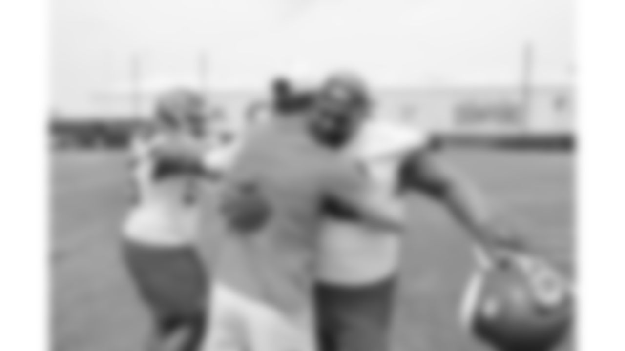Kansas City Chiefs nose tackle Mike Pennel (69) hugs former punter Dustin Colquitt while attending a practice during phase 3 of OTAs on Wednesday, June 4, 2025 in Kansas City, MO.