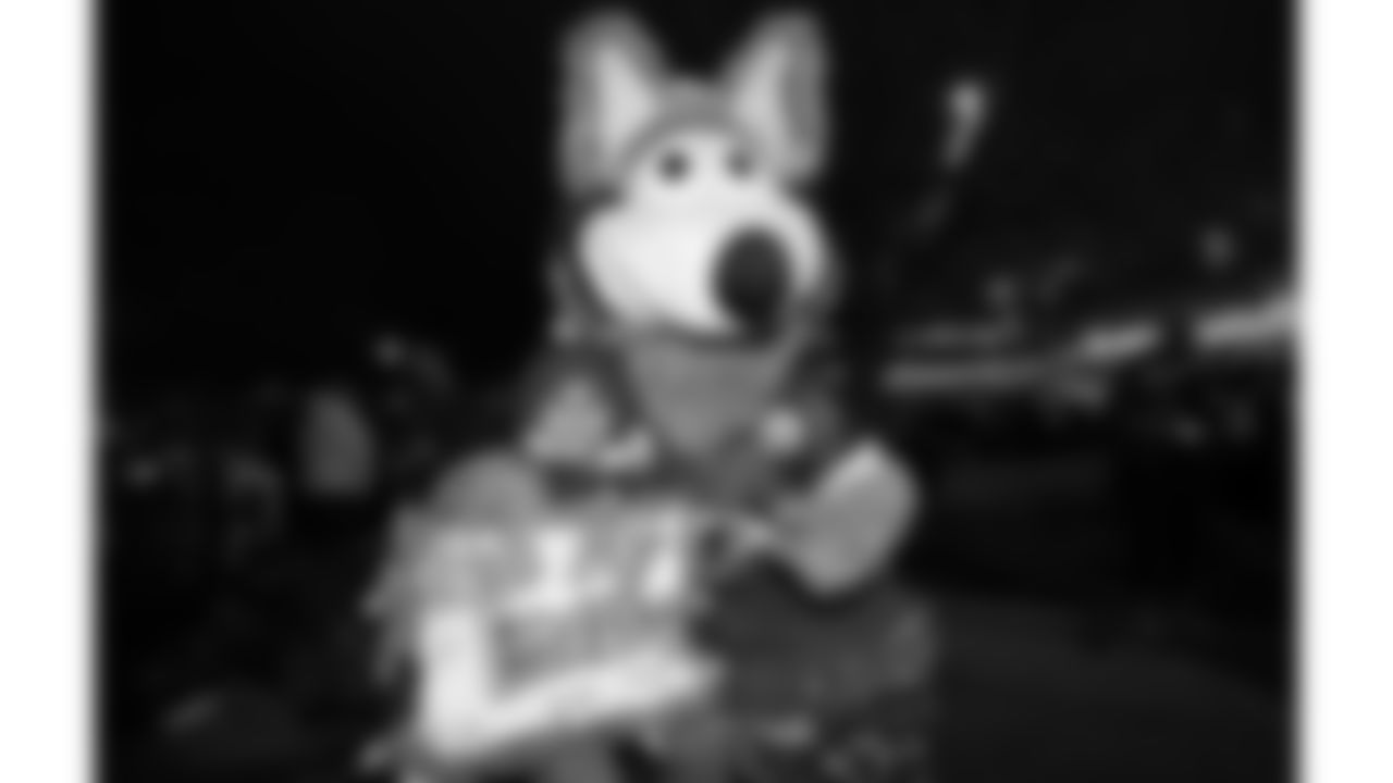 KC Wolf with a fan prior to the NFL Week 14 matchup against the Los Angeles Chargers on Sunday, December 11, 2024 in Kansas City, MO.
