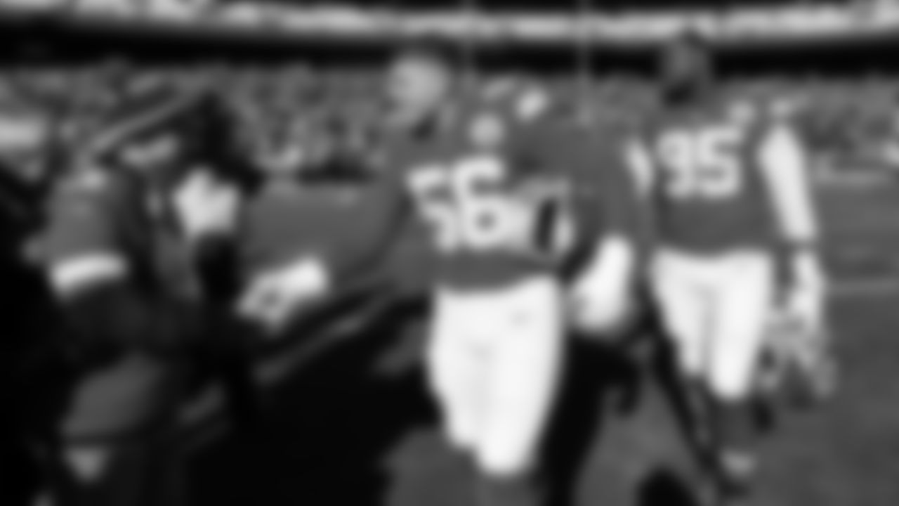 Kansas City Chiefs defensive end George Karlaftis (56) shakes hands with Kingdom Champ - Bradley Elpern prior to an NFL week 15 matchup against the Los Angeles Chargers, Sunday December 14, 2025.