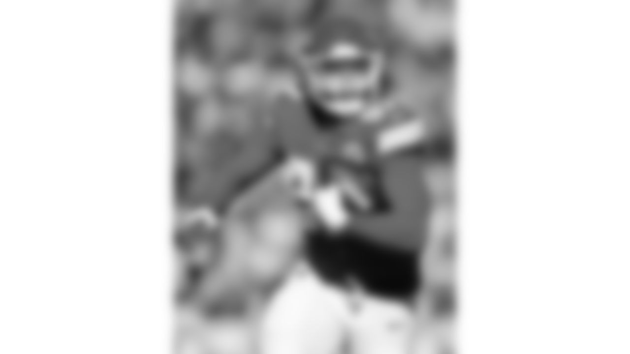 Kansas City Chiefs defensive end Ashton Gillotte (97) intercepts the ball during a week 15 NFL football game against the Los Angeles Chargers, Sunday, December 14, 2025 in Kansas City, MO.