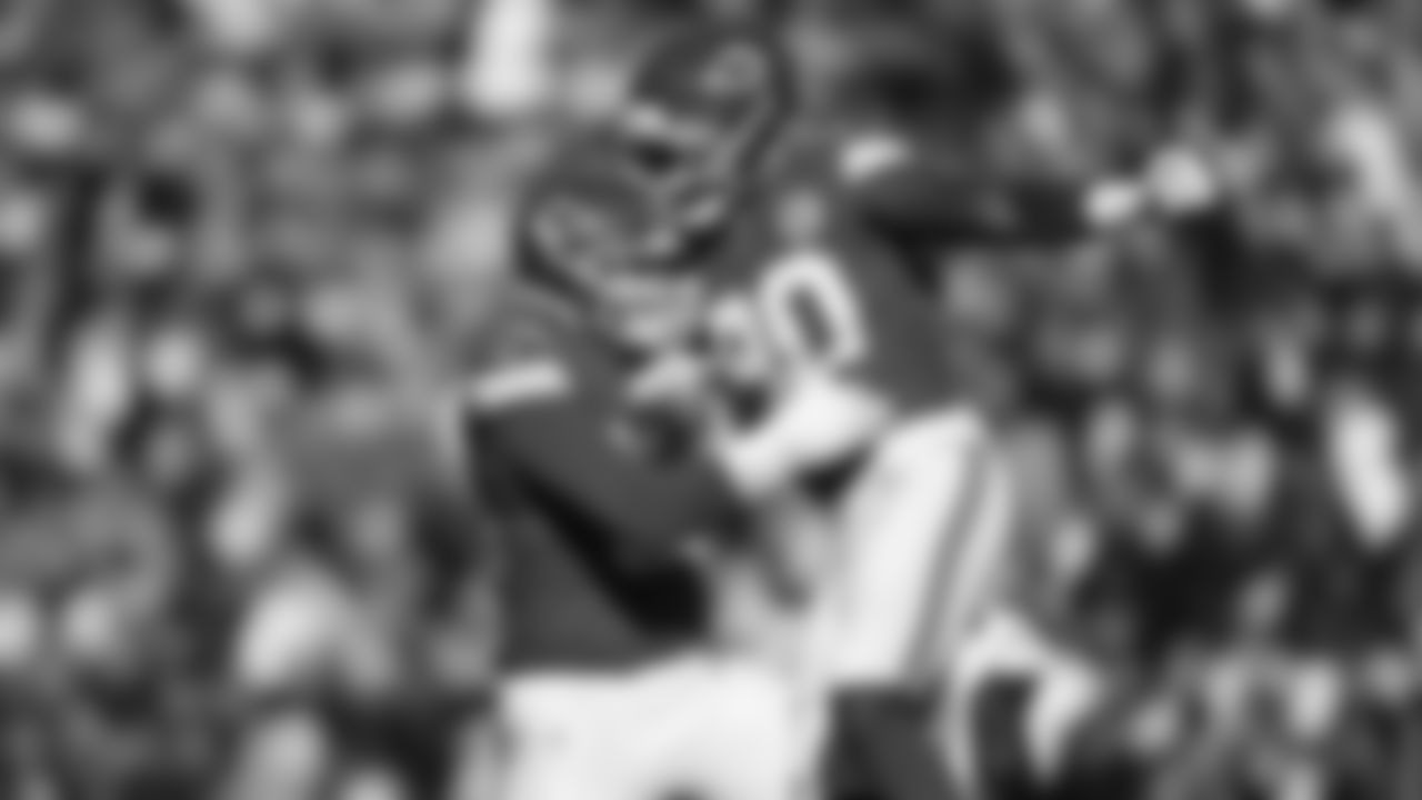 Defensive end Charles Omenihu (90) and Kansas City Chiefs defensive end George Karlaftis (56) celebrate during an NFL week 15 matchup against the Los Angeles Chargers, Sunday December 14, 2025.