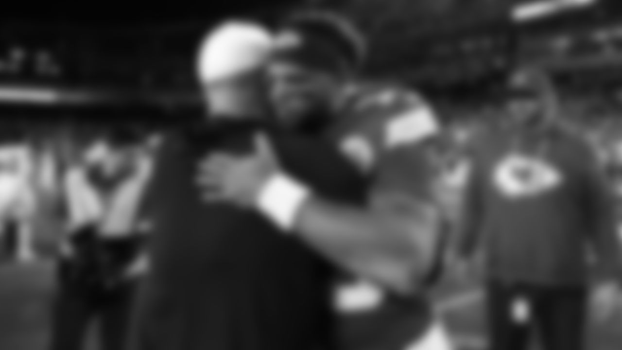 Kansas City Chiefs quarterback Chris Oladokun (19) hugs a Denver Bronco after an NFL week 17 matchup against the Denver Broncos, Thursday, December 25, 2025.