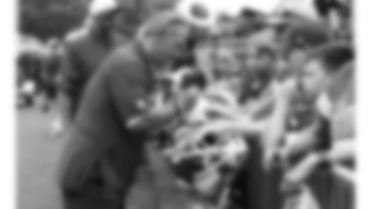 Kansas City Chiefs Defensive Coordinator Steve Spagnuolo with fans after training camp on day 3 of practice Thursday, July 24, 2025.