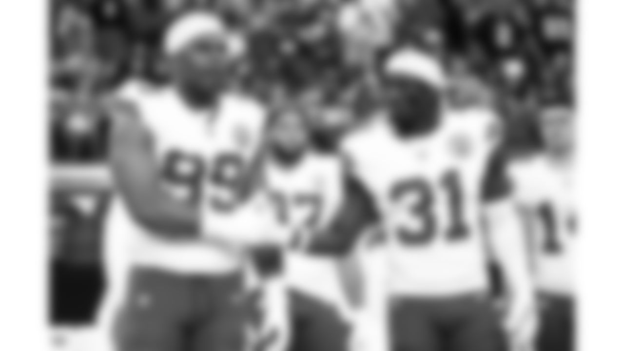 Kansas City Chiefs defensive tackle Jerry Tillery (99) and linebacker Jeffrey Bassa (31) shake hands prior to a week 18 game against the Las Vegas Raiders on Sunday, January 3, 2026.