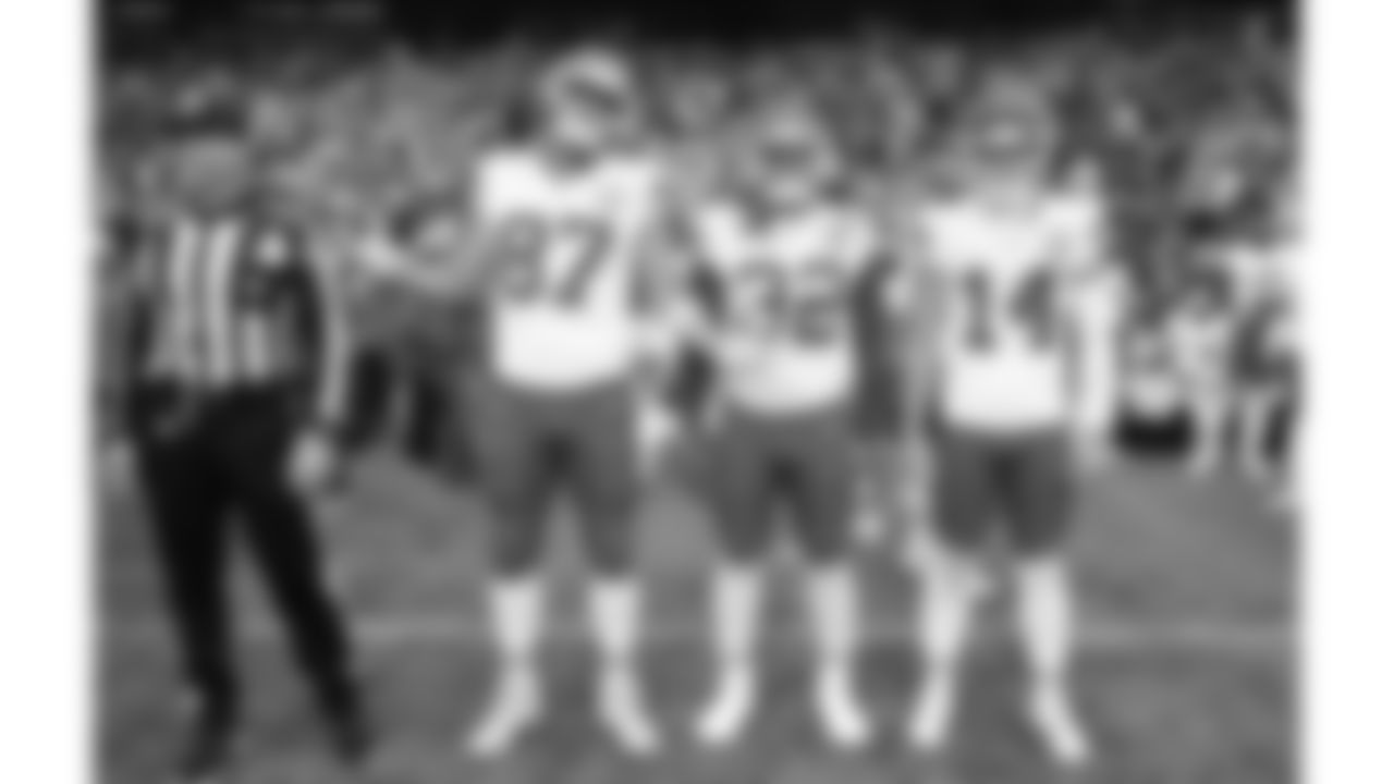 Kansas City Chiefs game captains tight end Travis Kelce (87), linebacker Nick Bolton (32), and punter Matt Araiza (14) line up prior to a preseason week 2 NFL football game against the Seattle Seahawks, Friday, August 15, 2025 in Seattle, WA.
