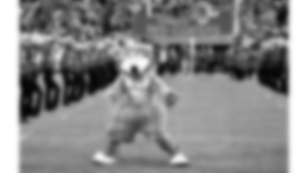 KC Wolf stands on the field during the pre game introductions while wearing a Gladiator costume before a 2001 home game.
