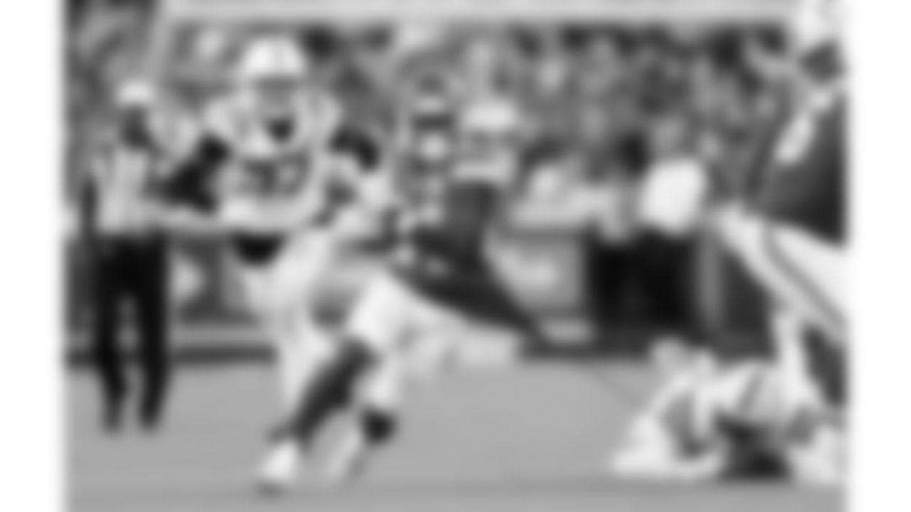 Kansas City Chiefs running back Brashard Smith (24) gets his shirt torn while he runs the ball during a week 12 NFL football game against the Indianapolis Colts, Sunday, November 23, 2025 in Kansas City, MO.