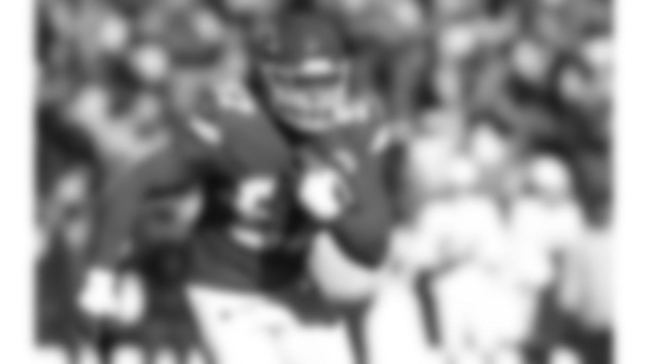 Kansas City Chiefs defensive end Ashton Gillotte (97) intercepts the ball during a week 15 NFL football game against the Los Angeles Chargers, Sunday, December 14, 2025 in Kansas City, MO.