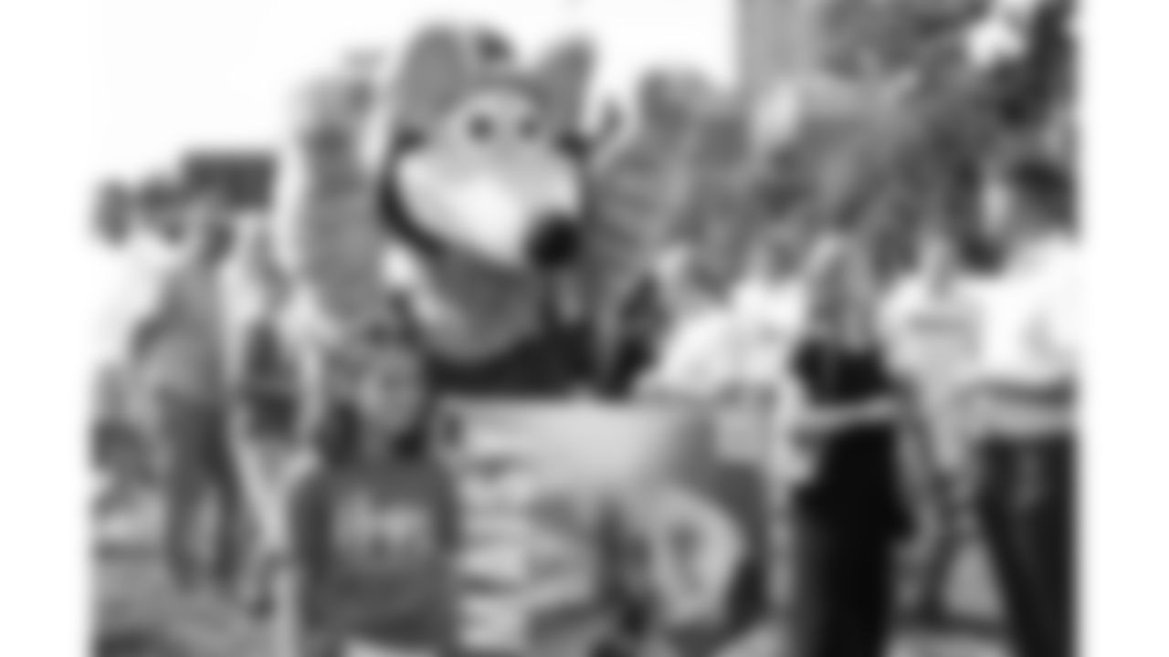 KC Wolf interacts with attendees at the Bradens Hope Hero Parade and Fountain Dyeing event on Friday, August 29, 2025 at Mill Creek Park in Kansas City, MO.