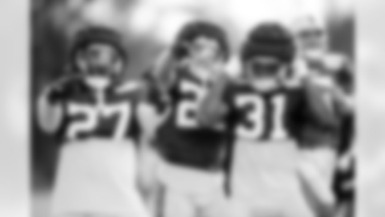RB Evan Hull #26, RB Tyler Goodson #31 and RB Trey Sermon #27