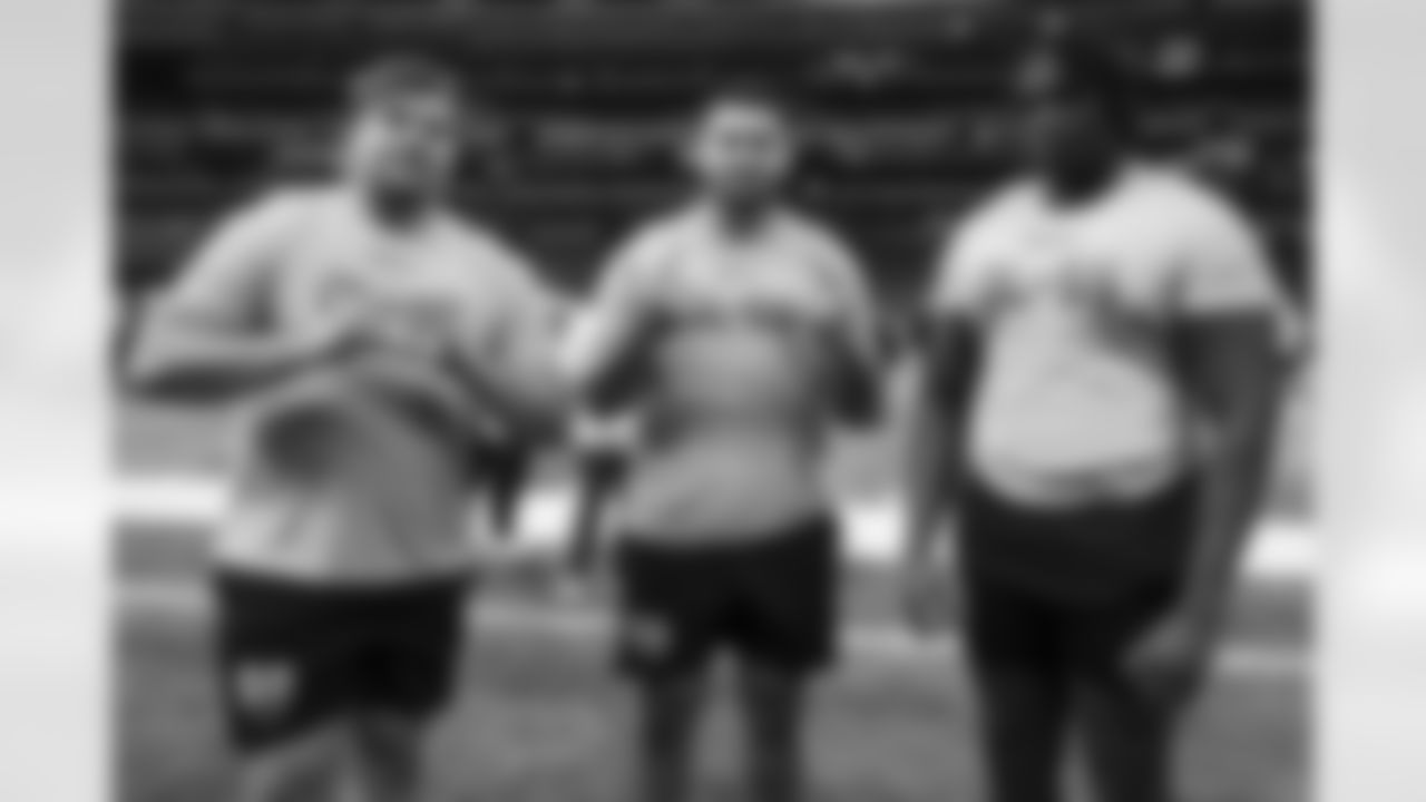 Illinois offensive lineman Julian Pearl, Kansas offensive lineman Dominick Puni, and Houston offensive lineman Patrick Paul pose for a photo during the 2024 NFL Scouting Combine on Sunday, March 3, 2024 in Indianapolis, Indiana. (Kara Durrette/NFL)
