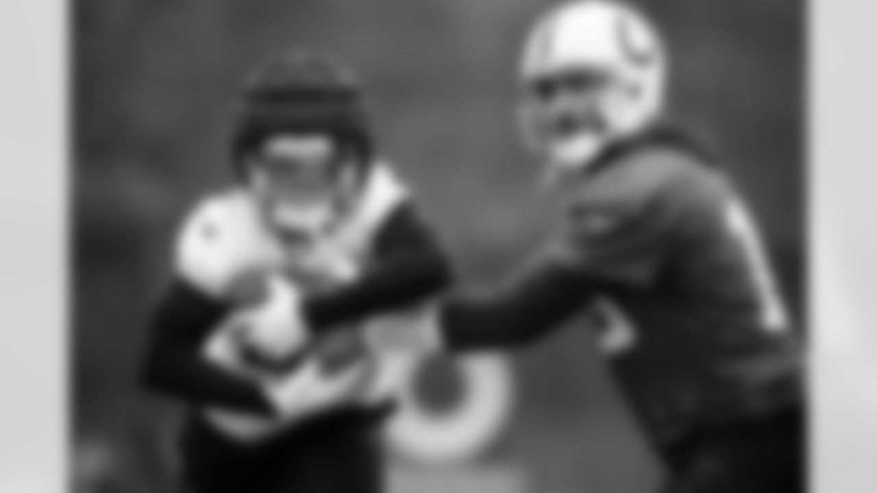 RB Jonathan Taylor #28 and QB Joe Flacco #15
