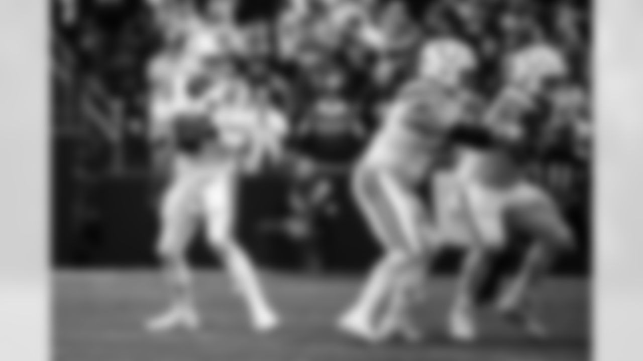 QB Philip Rivers #17, G Matt Goncalves #71 and C Tanor Bortolini #60