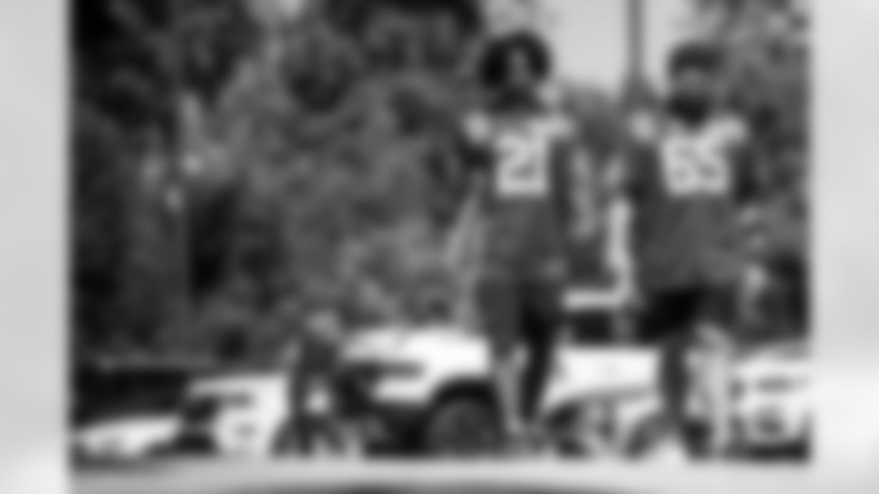 RB DJ Giddens #21 and C Mose Vavao #67