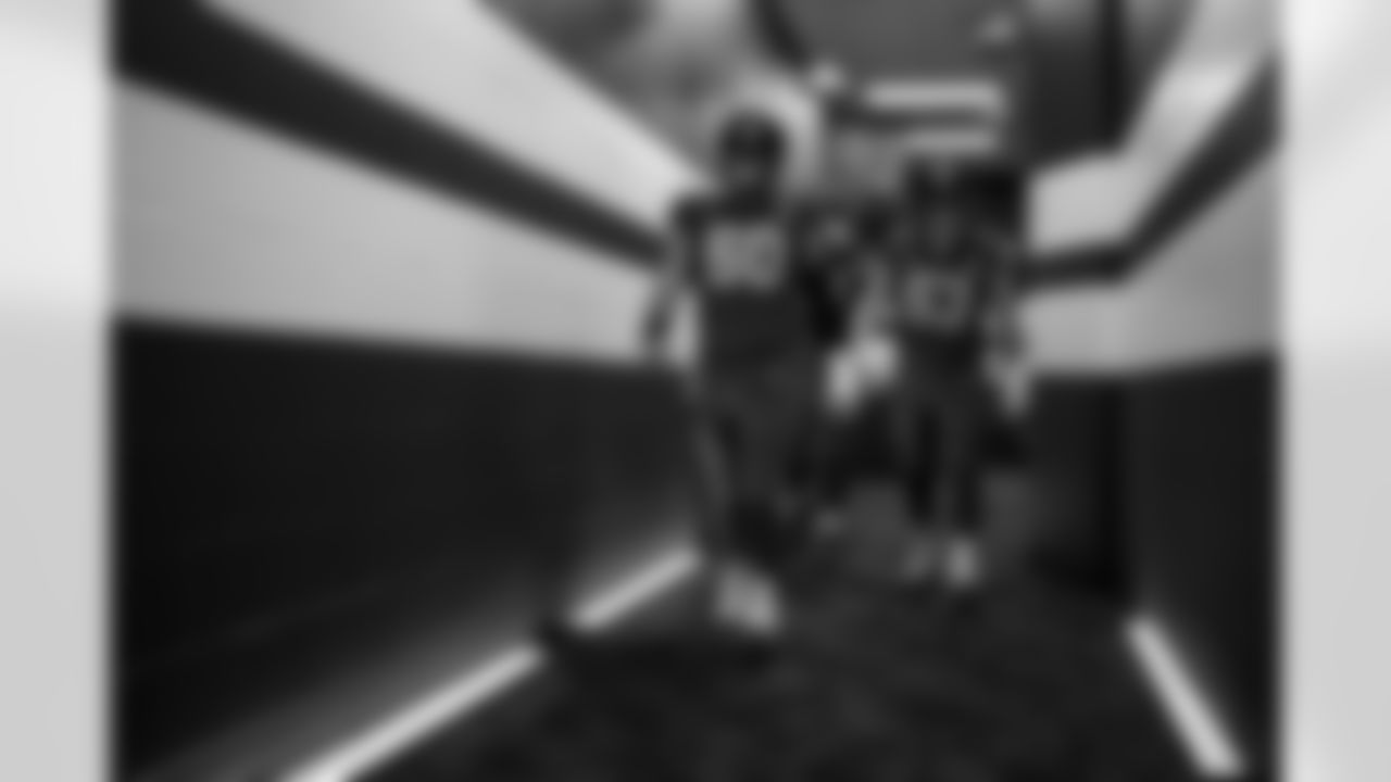 C Tanor Bortolini #60 and C Danny Pinter #63