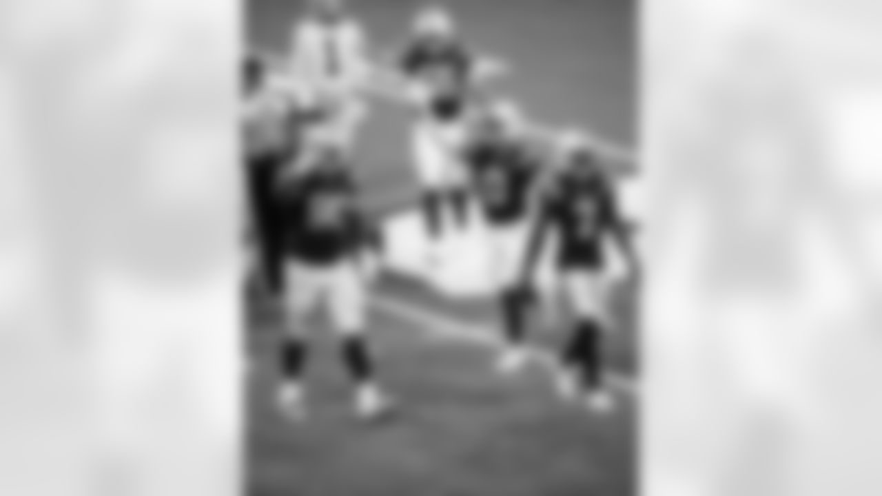 DT Grover Stewart #90, S Camryn Bynum #0 and CB Charvarius Ward #7
