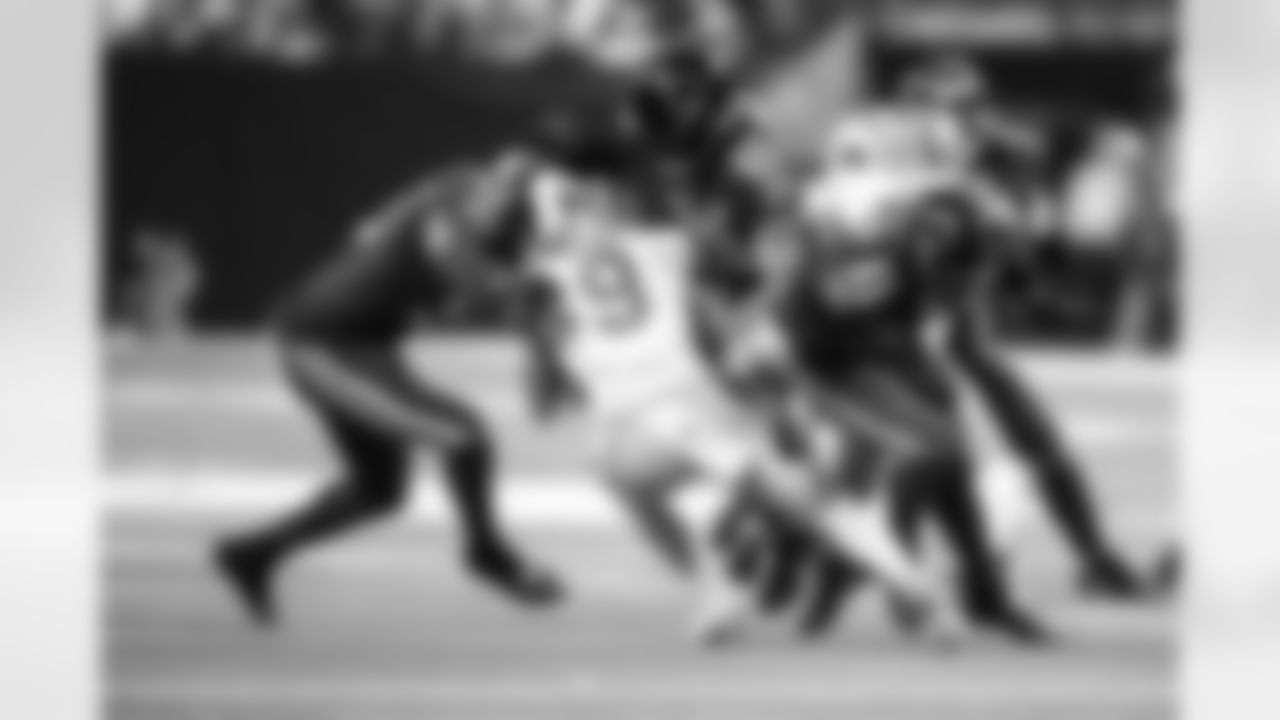 LB Segun Olubi #50, S George Odum #39 and RB Tyler Goodson #31