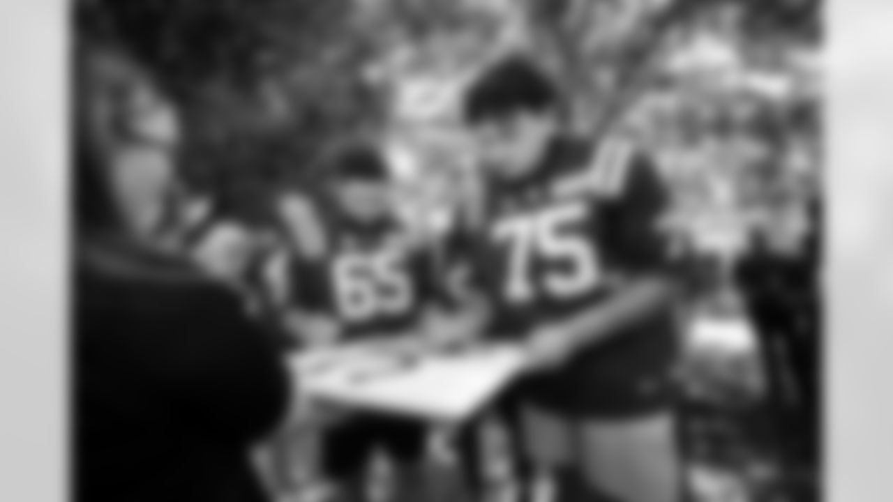 C Mose Vavao #67 and T Jalen Travis #75