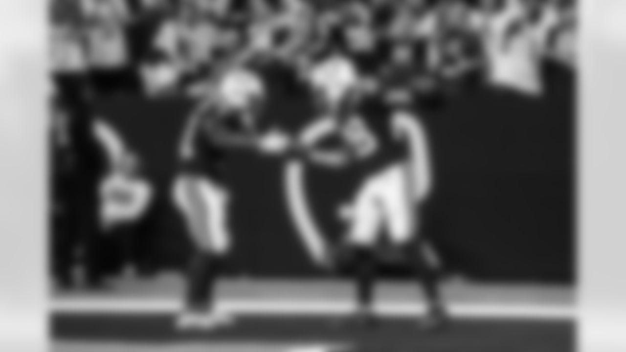 RB Tyler Goodson #31 and RB Jonathan Taylor #28