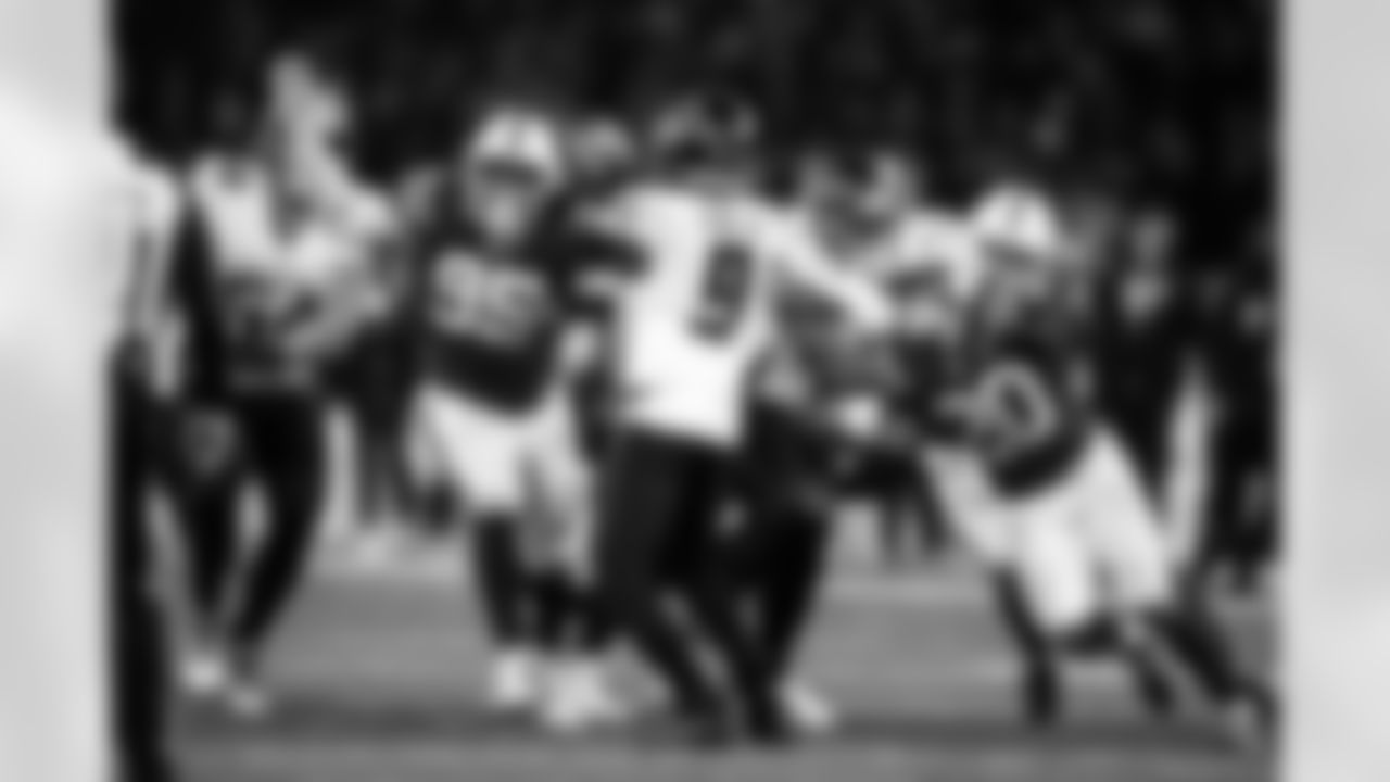 DT Adetomiwa Adebawore #95 and S Nick Cross #20