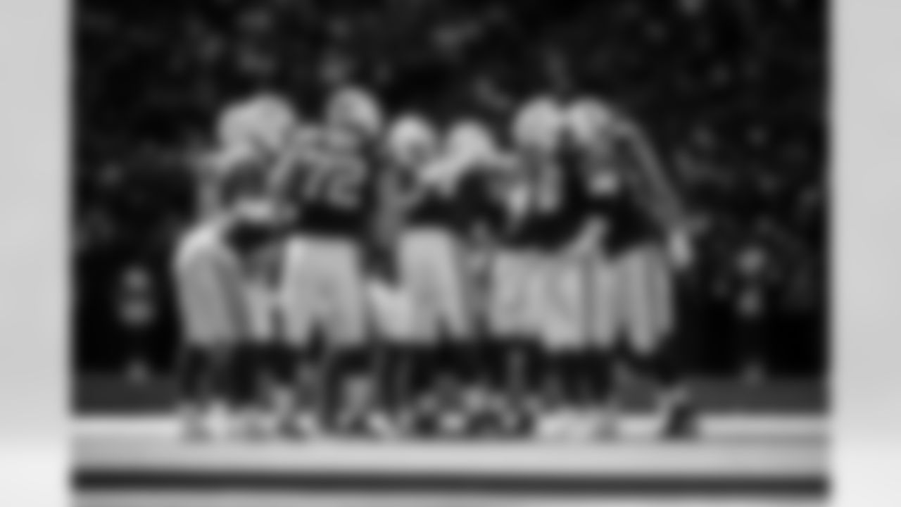 WR Michael Pittman Jr. #11, T Braden Smith #72, QB Daniel Jones #17 and C Tanor Bortolini #60