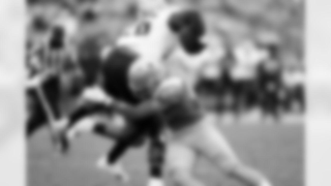 UCLA linebacker Carson Schwesinger (49) tackles Alabama State running back Marcus Harris II (26) during the second half of an NCAA college football game in Pasadena, Calif., Saturday, Sept. 10, 2022. (AP Photo/Ashley Landis)