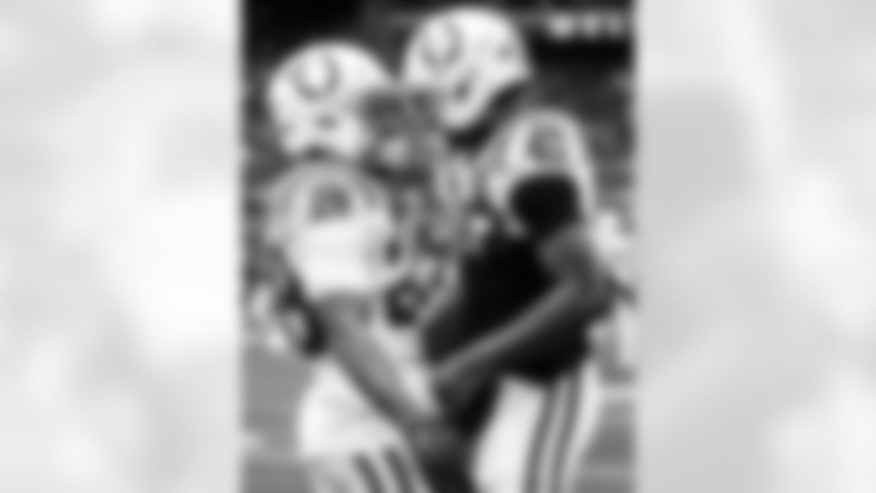 RB Jonathan Taylor #28 and CB Jaylon Jones #40